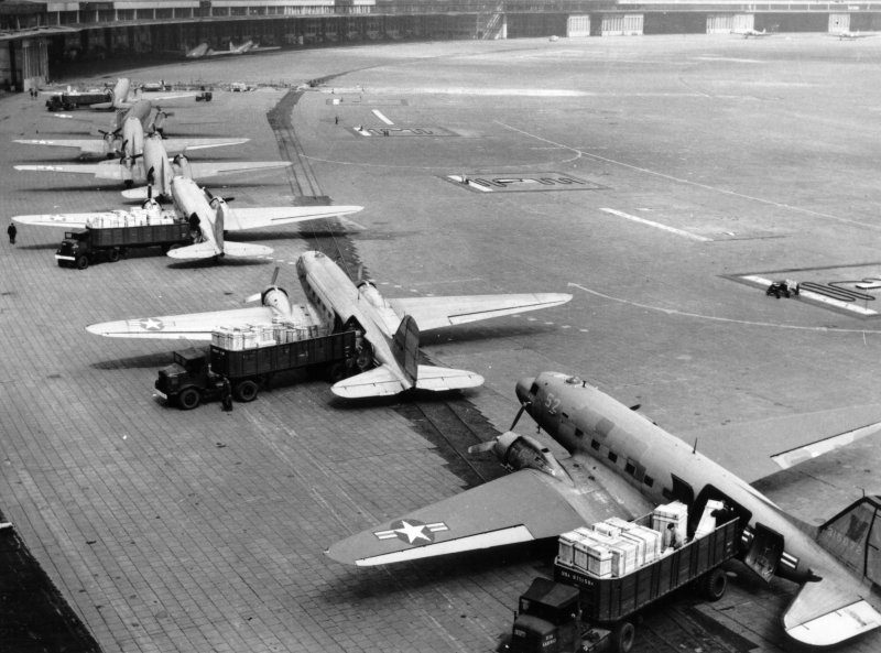 U.S. Navy and Air Force aircraft unload at Tempelhof Airport during the 1948 Berlin Airlift. SOURCE: U.S. AIR FORCE